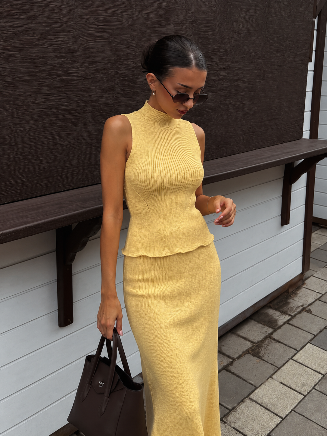 Limoncello Set — sleeveless mock-neck top with a ruffled peplum hem